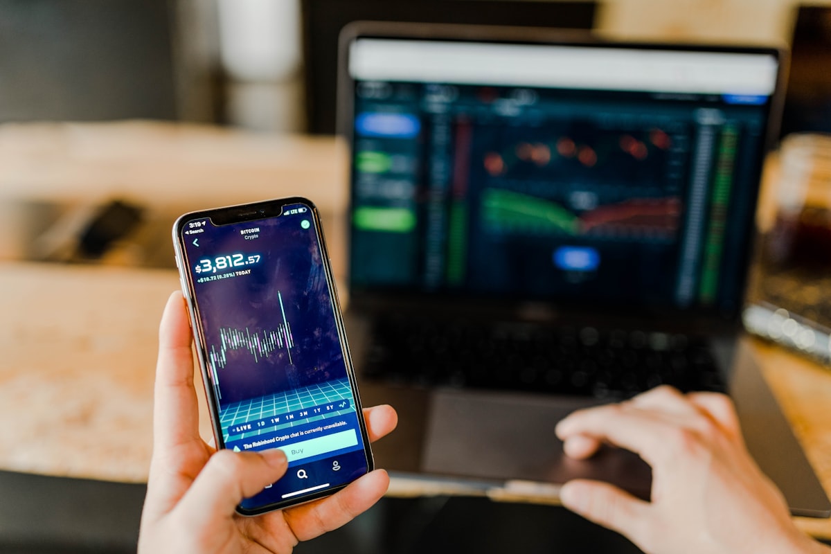 Trader using a stock market app on mobile